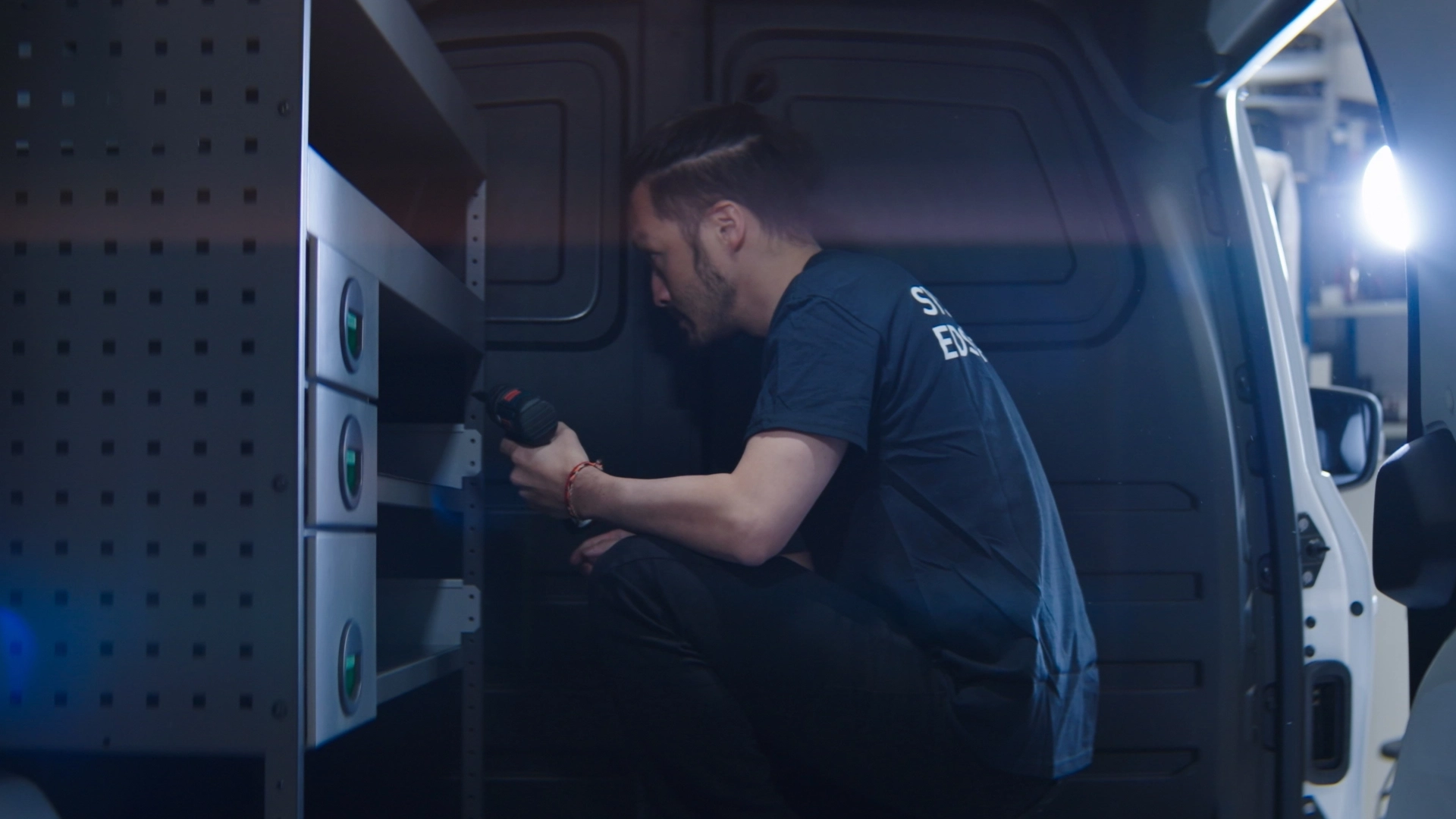 Man installing in a van.